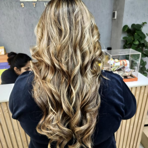 Twirling-into-the-new-week-with-a-cascade-of-golden-highlights-and-luscious-curls_-_madonnasalon-_ma